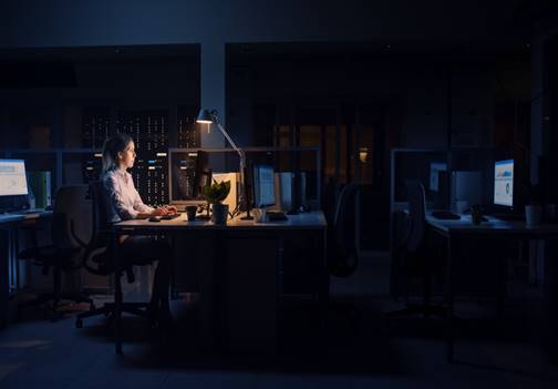 Woman in office alone, late at night - Overtime Violations